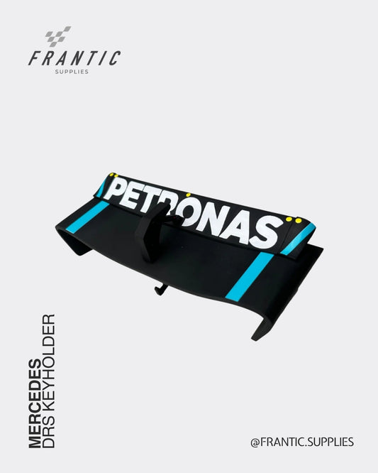 Mercedes DRS keyholder with Petronas logo and turquoise stripes across a black wing design on a white background, branded Frantic Supplies.