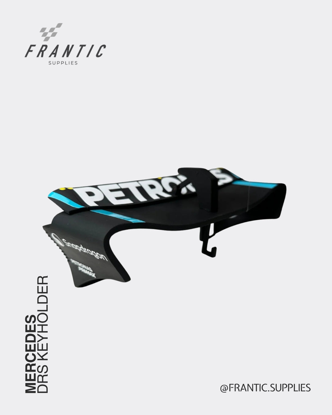 Mercedes DRS keyholder with Petronas branding in a black wing-shaped design displayed on a white background, branded Frantic Supplies.